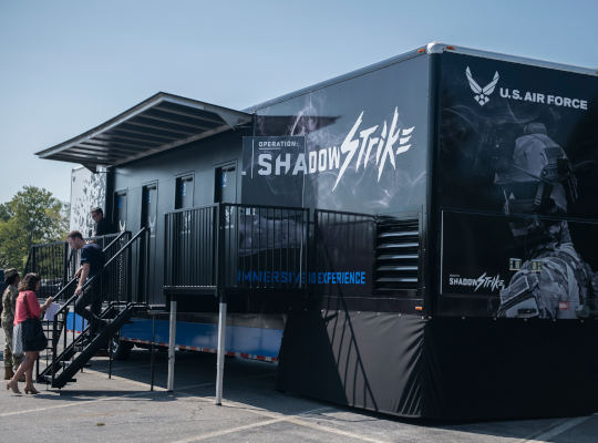 Visitors entering the U.S. Air Force Operation Shadow Strike immersive exhibit.